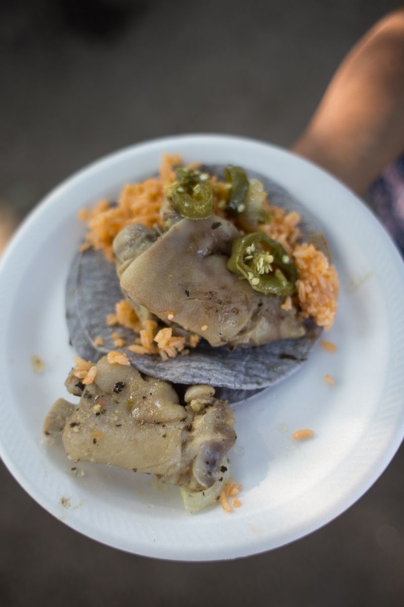 Pigs feet (with Spanish rice and blue corn tortillas). You boil the pigs feet first (no seasoning). Once it's cooked, you marinate for maybe an hour in vinegar, peppers, carrots, onions, garlic, and oregano.